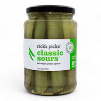 Glass jar of Classic Sours Dill Pickles filled with crunchy, whole dill spears in brine — all-natural, no artificial ingredients, and bursting with tangy, garlicky flavor.
